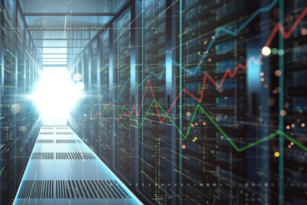 A brightly lit server room with rows of towering computer racks hums with activity. Overlaid digital graphs in red and green illustrate fluctuating data trends, reflecting cloud migration solutions at work. Light streams in from the corridor, highlighting the advanced technological environment.