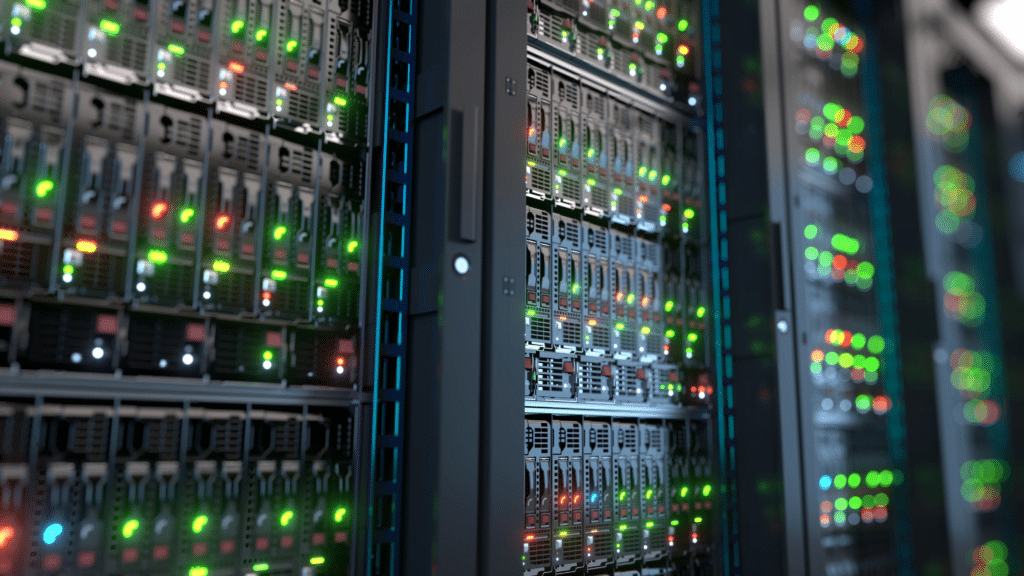 A close-up view of rows of server racks in a data center, filled with cutting-edge servers and network equipment. The blinking green, red, and blue LEDs highlight the secure and high-tech environment dedicated to managed disaster recovery.