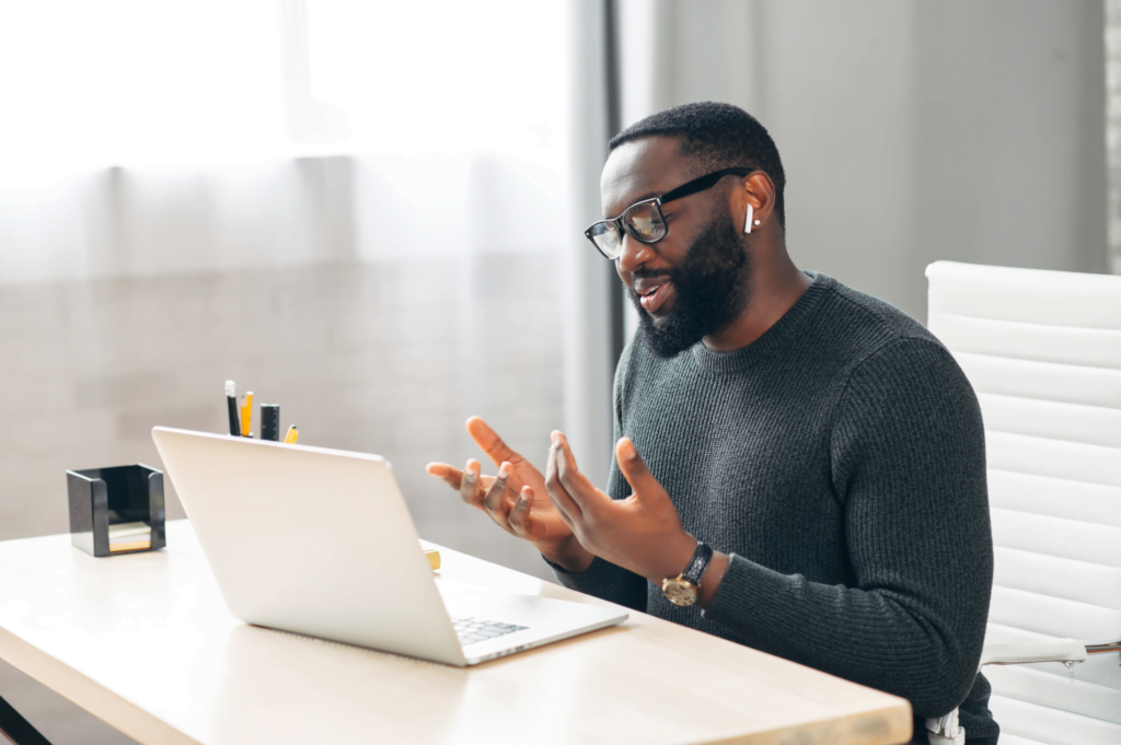 a man in front of a laptop