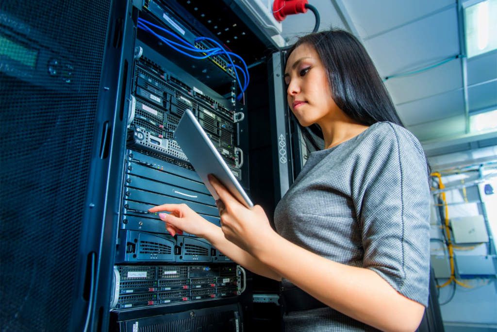 a woman standing in front of a server