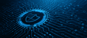 A digital illustration of a security shield icon surrounded by a complex network of circuit lines on a dark blue background, highlighting the cybersecurity skills gap and symbolizing data protection in 2024.